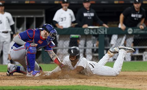 Chicago White Sox score 3 in the 8th — including overturned call at the plate — in 7-6 win over Texas Rangers